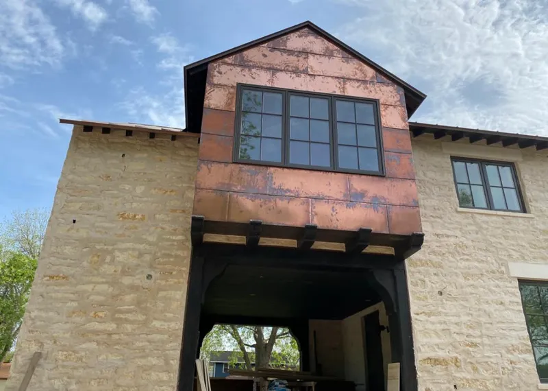Copper metal panel facade on a stone building for Skylight Installation in Palos Heights