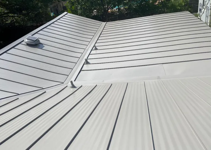 Solar attic fan installed on a metal roof for Roof Ventilation in Palos Heights